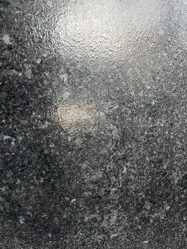 angola black leathered surface